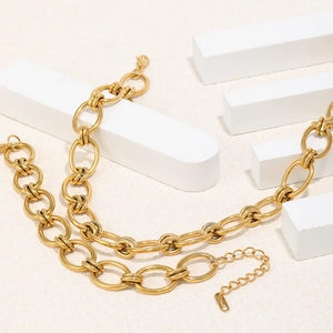 Polished 18K gold plated stainless steel chunky link chain necklace on stone blocks