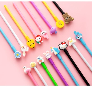 Macro shot of colorful cartoon neutral pens with 3D silicone animal toppers on pink surface
