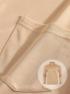 Macro shot of breathable waffle mesh fabric on khaki long sleeve polo shirt for men