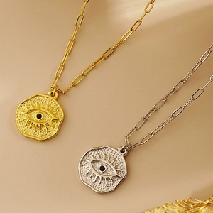 Evil eye irregular coin pendant necklace in gold and silver with paperclip chain link