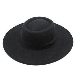 Detail showing the fine texture of the black wool felt wide brim fedora hat fabric