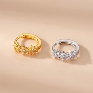 Star-shaped zircon earrings in gold and silver finish with minimalist floral patterns