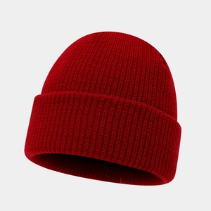 Detailed close-up showing the premium ribbed knit texture of this deep red winter beanie