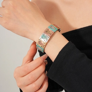 Macro detail of vintage colorful enamel mosaic bracelet with geometric etched patterns