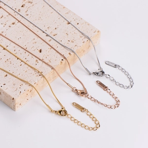 Minimalist irregular snake bone chain necklace set in silver, rose gold, and gold plating