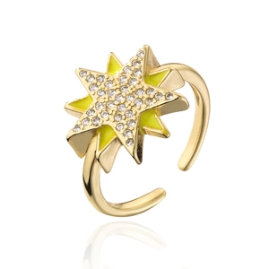 Detail of 18K gold star ring featuring yellow enamel and sparkling zircon accents