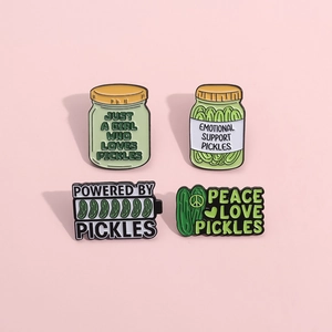 Funny green pickle enamel pin set with Just a Girl Who Loves Pickles text on pink background