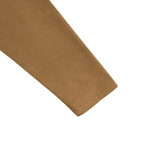 Detailed macro shot of double-needle stitching on the brown long-sleeve cuff fabric