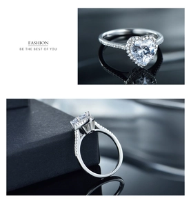 Detail of sterling silver heart-shaped ring with pavé diamonds and side-view setting
