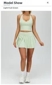 Close-up of light green tennis set with pleated mini skirt and halter sports vest