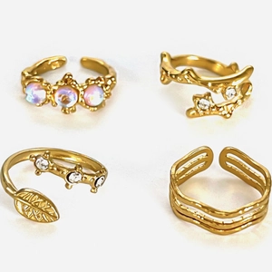 Vintage gold adjustable rings set featuring moonstone, leaf design and wavy geometric lines