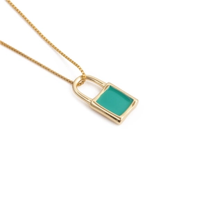 Detail view of a gold-plated padlock necklace featuring turquoise enamel and a box chain