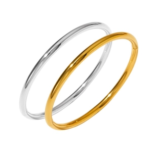 Polished stainless steel minimalist bangles in gold and silver finish on white background