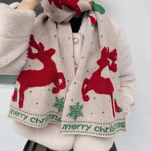 Beige knit Christmas scarf with red reindeer and green snowflake patterns for winter