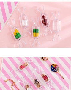 Macro shot of candy-shaped clear plastic storage boxes for rings and small jewelry pieces