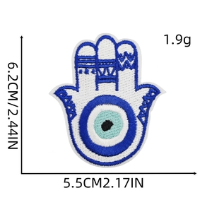 Embroidered evil eye patch in blue and white with detailed size and weight specs