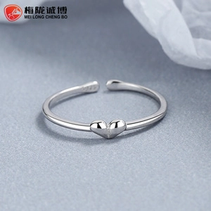 Macro view of S925 sterling silver heart ring showing the hallmark engraving and texture