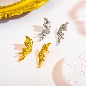 Modern Y2K style butterfly wing stud earrings in gold and silver stainless steel