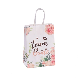 White wedding gift bag with pink floral patterns and rose gold Team Bride foil stamping