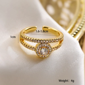 Macro detail of gold-plated double-band ring with zircons showing size and weight specs