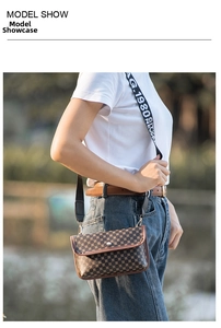 Outdoor model show of a brown quilted crossbody bag with a wide branded shoulder strap