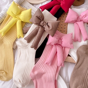 Colorful cotton blend bow socks for women and children in various soft autumn colors