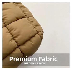 Close-up detail of khaki quilted cloud fabric with high-quality padding and matte texture