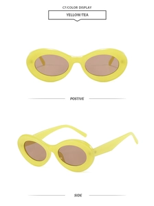 Detail view of yellow oval retro sunglasses with tea lenses and sturdy resin frames