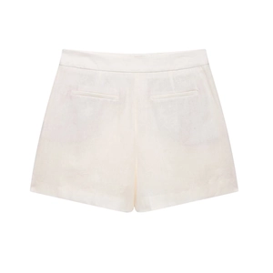 Detail of white high-waisted cotton shorts with symmetrical welt pockets on the back