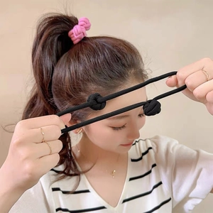Elastic candy color flower hair ties shown on a model for high ponytail styling