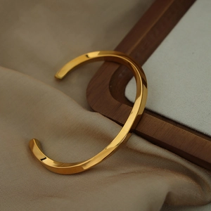 Minimalist gold plated titanium steel open cuff bracelet with geometric twisted design