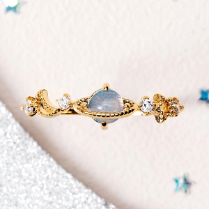 Blue opal Saturn ring in gold plating with starry orbital design and zircon stones