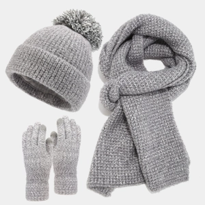 Three-piece winter knit set with pompom hat, scarf, and touch screen gloves in grey