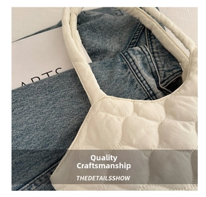 Close-up of wavy quilted shoulder bag texture highlighting soft fabric and craftsmanship