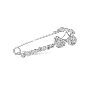 Elegant silver cherry brooch with white rhinestones and textured metal leaves on white background