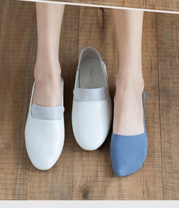 Detail showing ultra-low cut light blue ice silk liner sock invisible with white loafers
