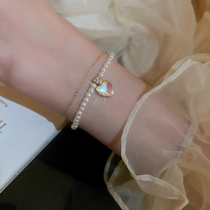Gold-plated layered bracelet with pearls, heart charm and cat eye stone for women