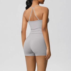 Detail of cross-back yoga tank top and seamless shorts in high-stretch grey fabric