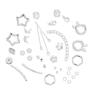 Detailed overhead view of silver DIY jewelry making components including beads and clasps