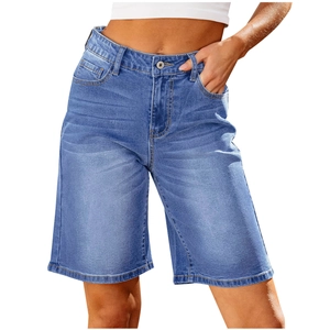 Close-up of blue washed denim capri pants featuring a single button waist and pocket details
