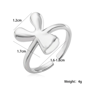 Macro shot of silver-plated flower-shaped open ring with 1.2cm floral design detail