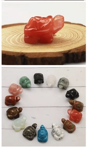 Macro shot of rose quartz turtle carving alongside various colorful gemstone tortoises
