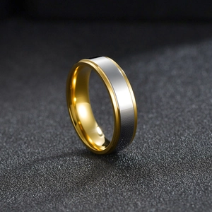 Minimalist two-tone stainless steel ring for men with gold accents and brushed finish
