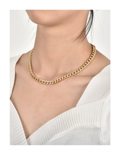 Close-up of 18K gold plated Cuban chain necklace with sparkling pavé cubic zirconia