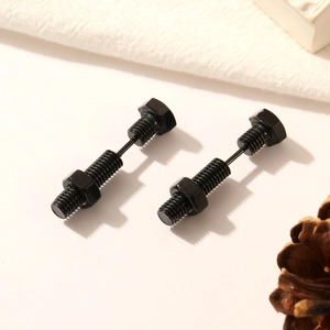 Matte black industrial bolt and nut stud earrings for men and women on minimalist background