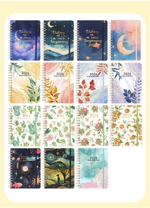 Macro display of 2026 weekly planner covers with colorful marble and floral designs