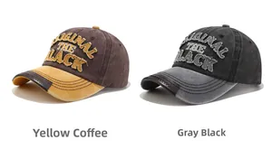 Detail of vintage washed baseball caps with embroidered lettering and distressed patch