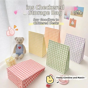 Detailed view of colorful checkered paper gift bags for desktop organization and storage