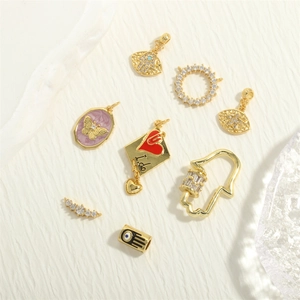 Gold Hamsa Hand and Evil Eye charms with zircon inlay and enamel details for DIY jewelry making