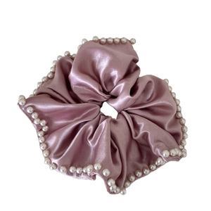 Elegant lilac pink satin scrunchie with white pearl trim for stylish hair styling